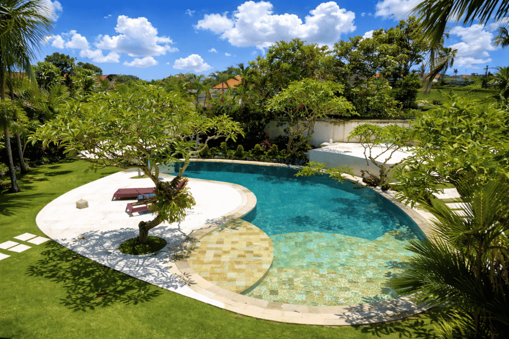 tropical backyard with a stunning pool.png
